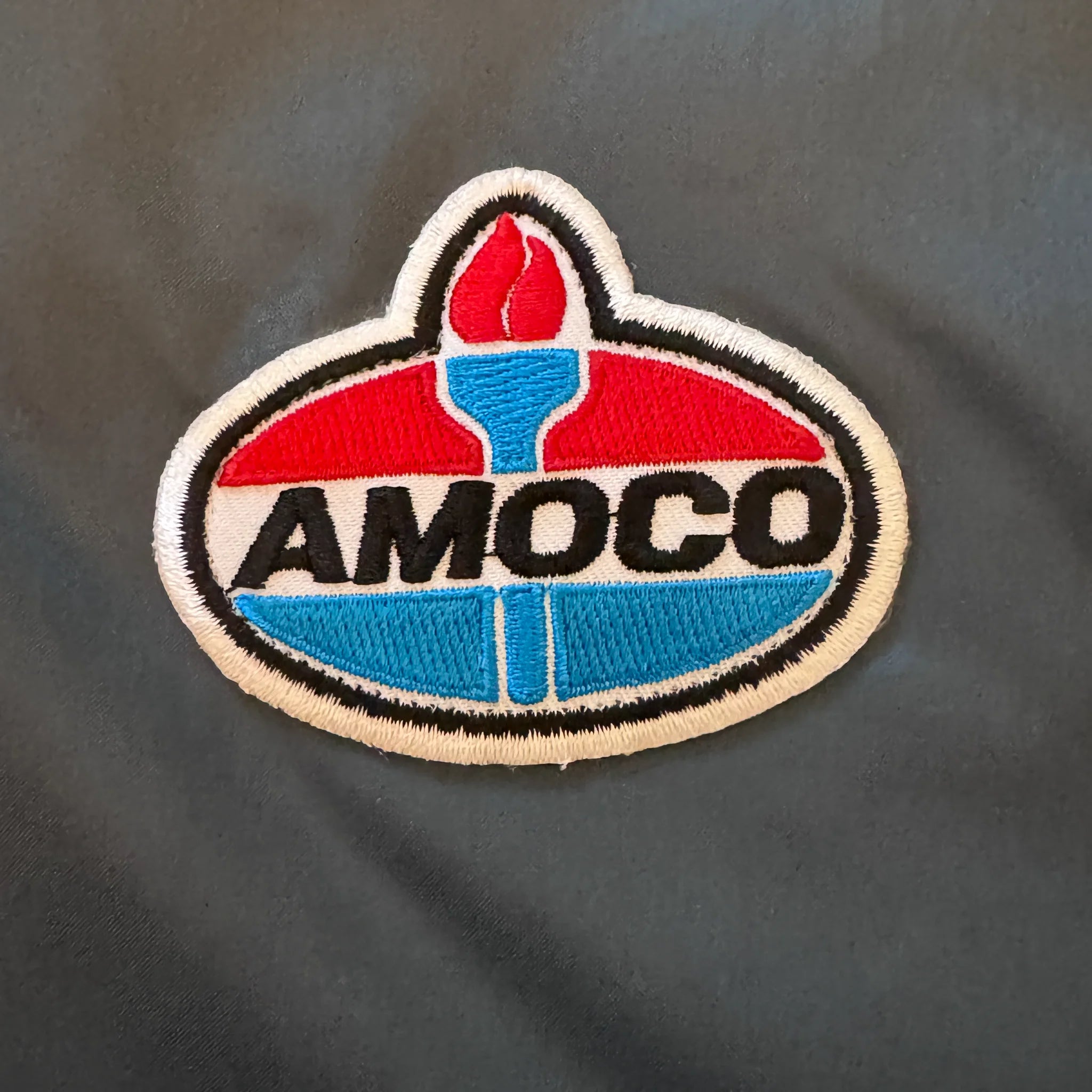 Veste bombardier Amoco en satin bleu XL des années 1990