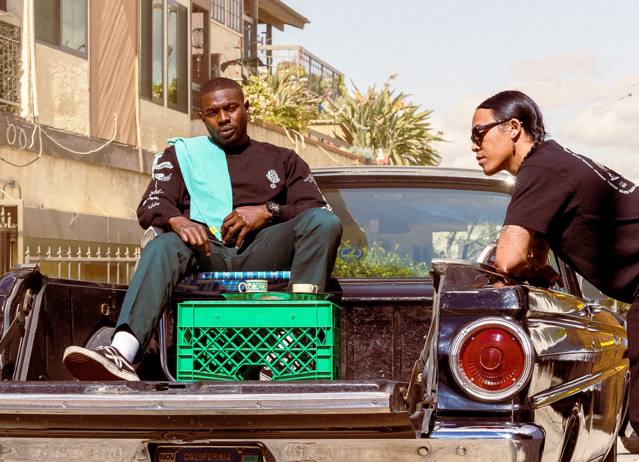 Two people in the bed of a 1964 Ford Ranchero